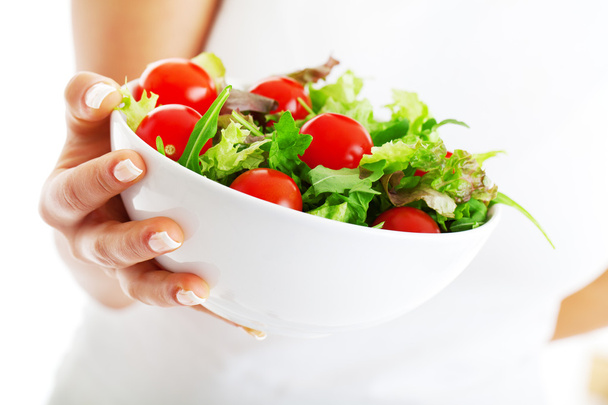 Salad bowl in woman hands - Photo, Image