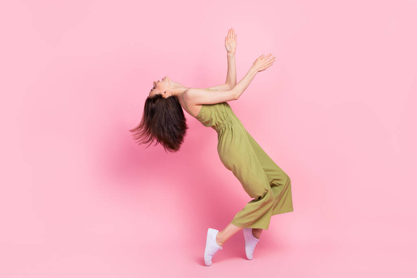 Full length profile side photo of positive overjoyed lady trendy outfit stand toes look empty space isolated on pink color background. - 写真・画像