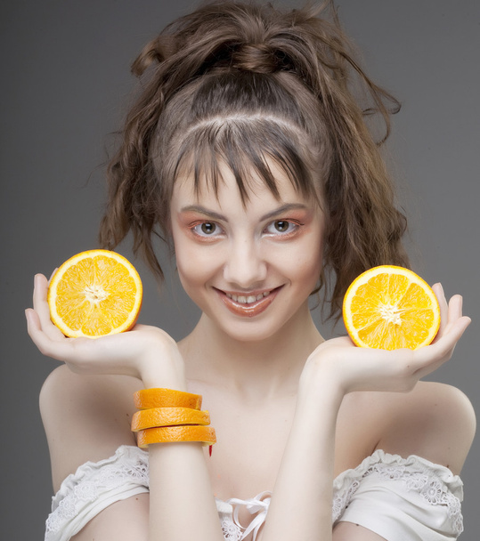 womans face with juicy orange - Foto, Bild