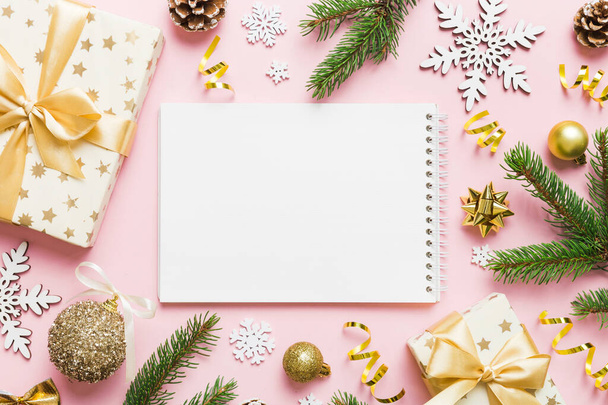 Christmas blank greeting card mock-up scene. Creative layout made of Christmas tree branches and paper card note. Flat lay. Nature New Year concept. - 写真・画像