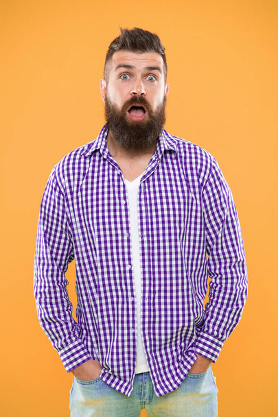 Quite surprised. Beard fashion and barber concept. Man bearded hipster stylish beard yellow background. Barber tips maintain beard. Beard and mustache care. Hipster appearance. Emotional expression. - Photo, Image