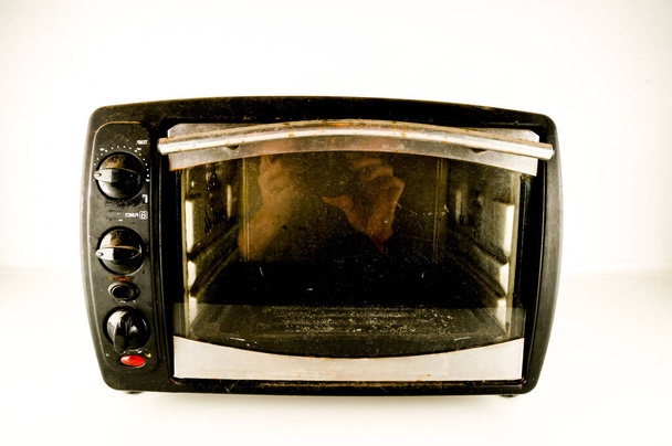 small electric oven isolated in the kitchen - Photo, Image