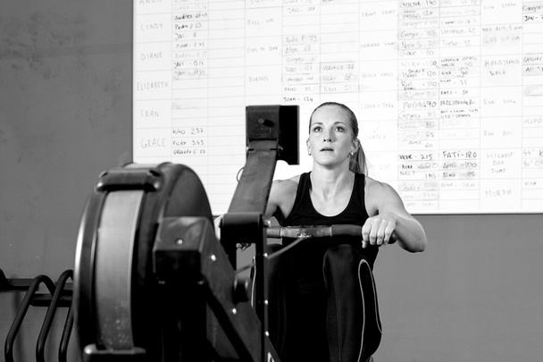 woman on rowing machine - crossfit workou - Photo, Image