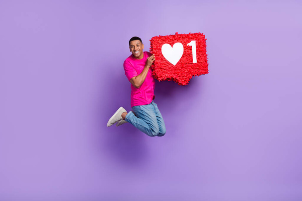 Full body portrait of carefree handsome guy jumping arms hold large like collage isolated on purple color background. - Fotoğraf, Görsel
