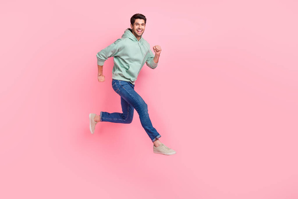 Full length photo of cheerful positive boy trendy comfort clothes go empty space low price black friday isolated on pink color background. - Фото, изображение