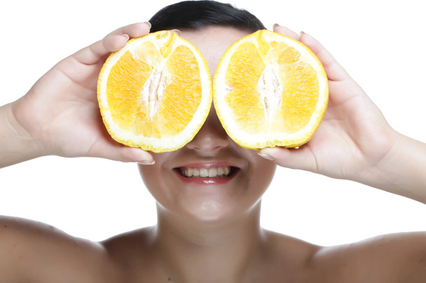 woman with oranges in her hands - Zdjęcie, obraz