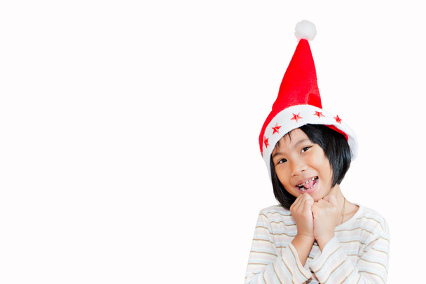Asian girl wearing santa hat isolated on white. - Zdjęcie, obraz