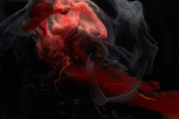 Red black ink abstract background. Acrylic paint backdrop for perfume, hookah, cosmetics. Mysterious smoke clouds, colorful fog - 写真・画像