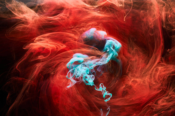 Emerald red ink abstract background. Acrylic paint backdrop for perfume, hookah, cosmetics. Mysterious smoke clouds, colorful fog - Fotografie, Obrázek