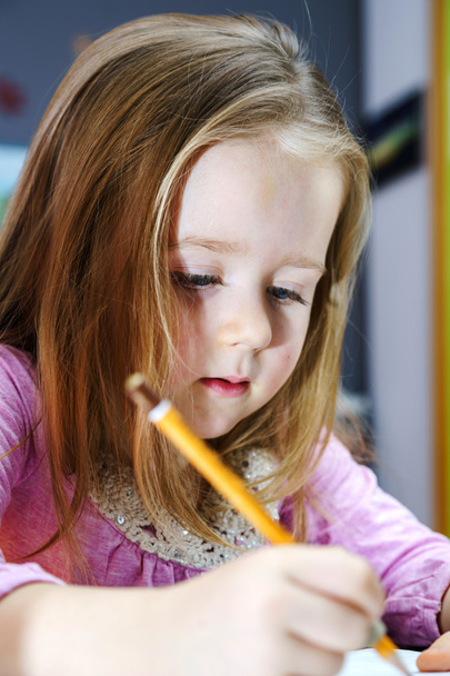 Cute little girl studing to speaking and writing letters at home - Foto, Bild