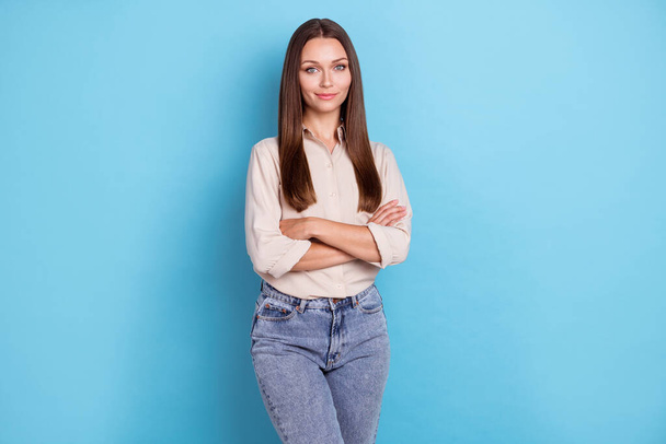 Photo of good looking cute person lady dressed fashionable outfit clothes arm folded isolated on blue color background. - Фото, зображення