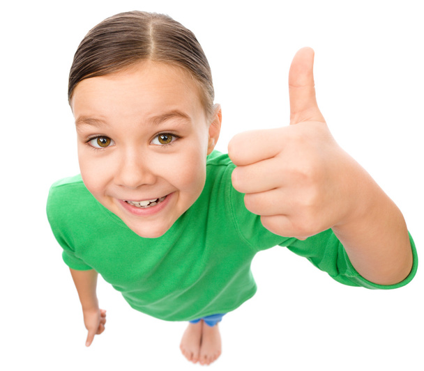 Little girl is showing thumb up gesture - Photo, Image