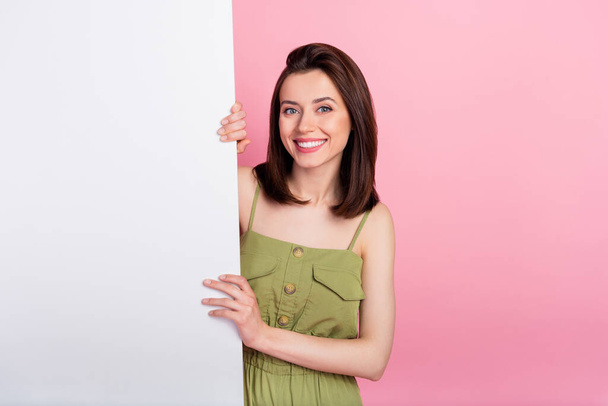 Photo of pretty cheerful lady good mood arm hand touch hold blank empty space isolated on pink color background. - Foto, imagen