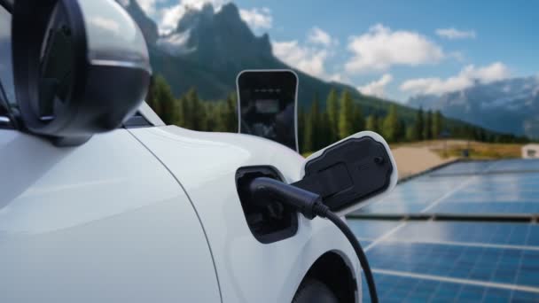 Concept of progressive future renewable and clean energy technology by charging station recharge EV cars battery powered by solar cell for eco-friendly sustainable energy system. - Footage, Video