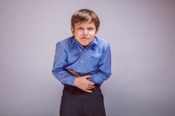 tinédzser fiú 10 éves európai megjelenése gyomorfájás, ga - Fotó, kép