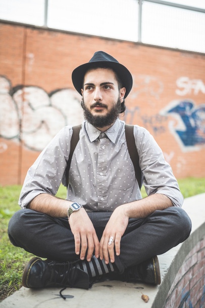 Hipster bearded man in hat in town - Photo, Image