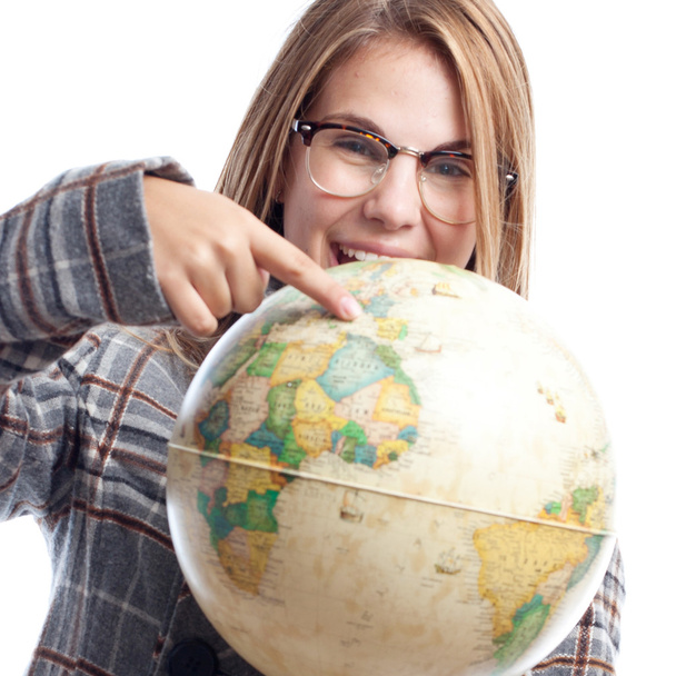 Young cool woman with world globe - Foto, afbeelding