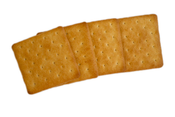 Соленые печенье изолированы на белом фоне
 - Фото, изображение