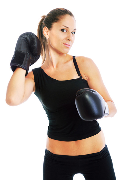 Young woman boxing - 写真・画像