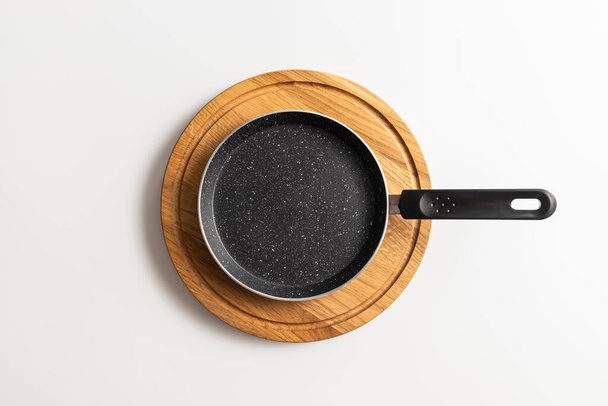 empty pan on wood board. pan for pancake. - Photo, Image