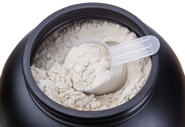 Container of milk whey protein. Close-up. - 写真・画像