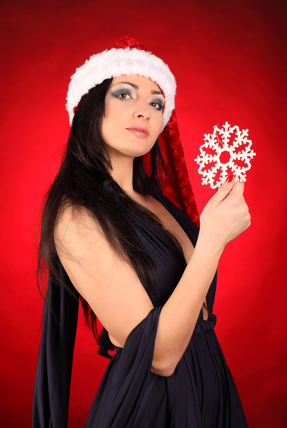 Beautiful and sexy woman wearing santa clause costume - Фото, изображение