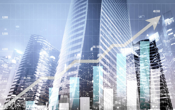Financial graphs and digital indicators overlap with modernistic urban area, skyscrabber for stock market business concept. Double exposure. - Photo, image