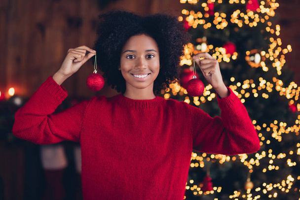 Photo of cheerful adorable small girl toothy smile hands hold hanging x-mas tree ball toys garland lights newyear indoors. - Φωτογραφία, εικόνα