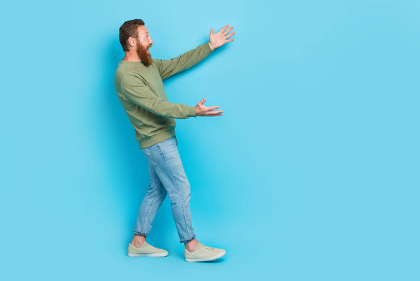 Full body photo of attractive young guy excited stretching arms meet old friend cuddle wear khaki clothes isolated on cyan color background. - Foto, Imagem