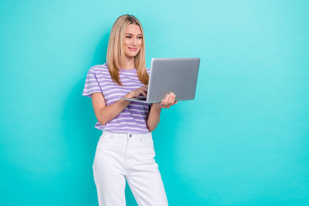 Photo of progressive business woman wear stylish outfit hold netbook typing working it developer online isolated on aquamarine color background. - Φωτογραφία, εικόνα