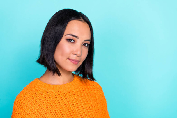 Portrait of positive girlish gorgeous woman with bob hairstyle wear orange sweater look at camera isolated on teal color background. - Foto, Imagem
