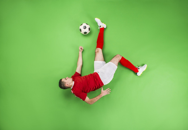 Football player in action - Foto, afbeelding