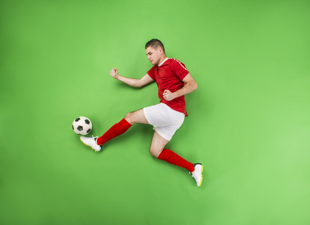 Football player in action - Foto, afbeelding