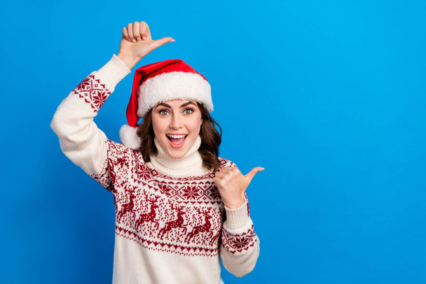 Photo of positive lady trendy warm ugly jumper two arm direct empty space wow omg impressed low prices isolated on blue color background. - Foto, immagini