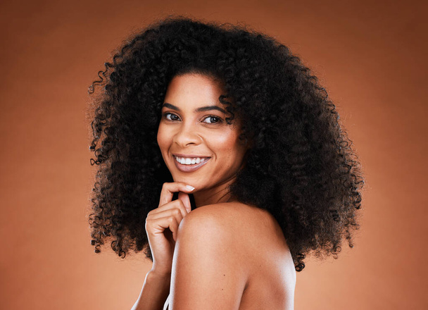 Black woman, skincare and cosmetic beauty with natural hair wellness or healthcare. African girl, portrait and luxury spa or self love motivation with self care happiness in brown studio background. - 写真・画像