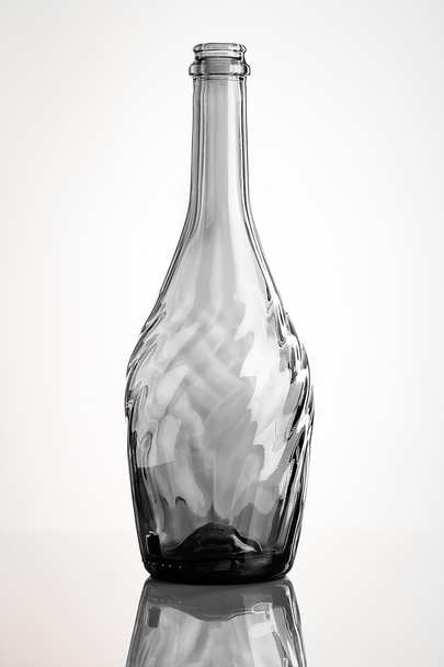 empty carved glass bottle with reflection - Фото, зображення