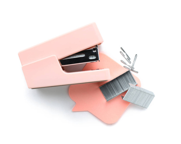 Stapler, sticky notes and staples on white background - Фото, изображение
