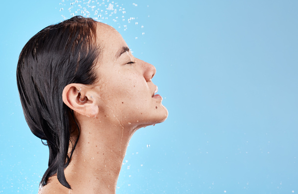 Heath, hair and woman in shower on blue background with mockup, advertising or product placement space. Haircare, water and skincare, hygiene routine in the morning asian woman with clean lifestyle - Fotografie, Obrázek