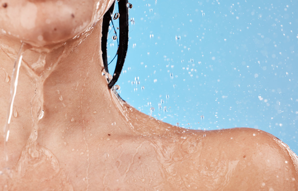 water, shower and woman shoulder closeup for skincare wellness cleaning or healthy morning routine for beauty. Under water, cosmetics treatment and young person washing in blue background studio. - Foto, Bild
