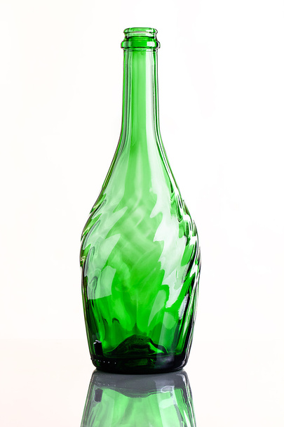 empty carved glass bottle with reflection - Zdjęcie, obraz