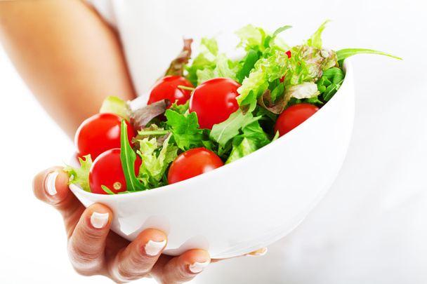 Salad bowl in woman hands - Foto, Imagen