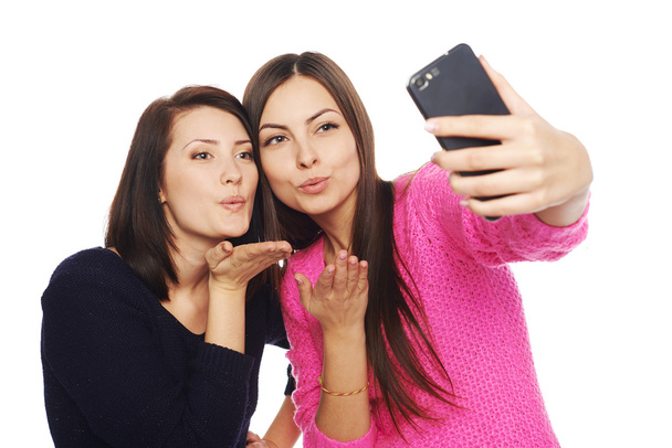 Two girls friends taking selfie with smartphone - 写真・画像