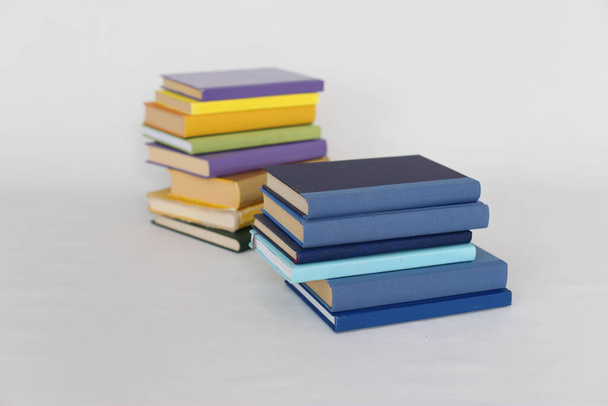 pile of books on white background. colorful bright illustration, closeup. - Фото, изображение