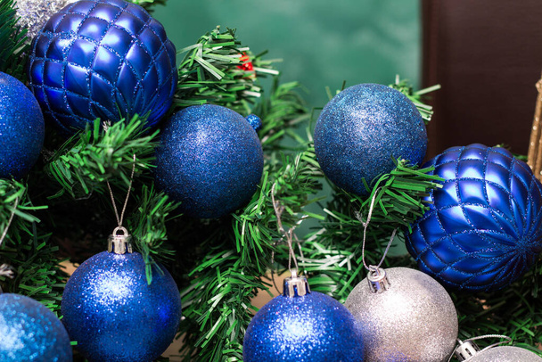 Silver and blue ornaments on the Christmas tree.  Christmas themes - Photo, Image