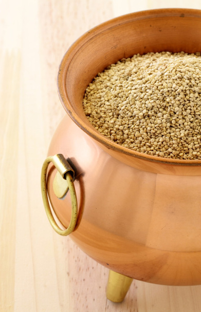 Raw quinoa on copper pot - Photo, Image