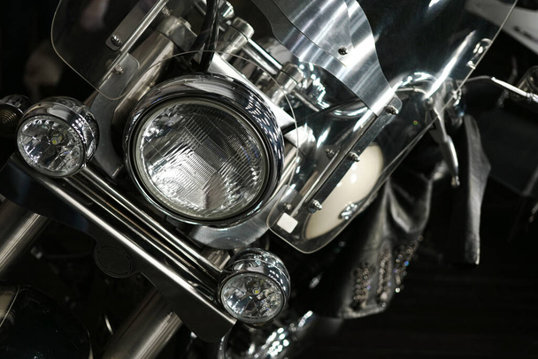 motorcycle light close-up detail of a chrome motorcycle                            - Photo, Image