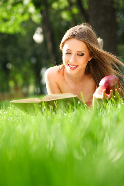 Woman in the park with book - Foto, imagen