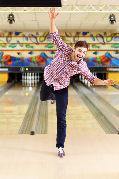 Young man have fun in bowling club - Fotó, kép