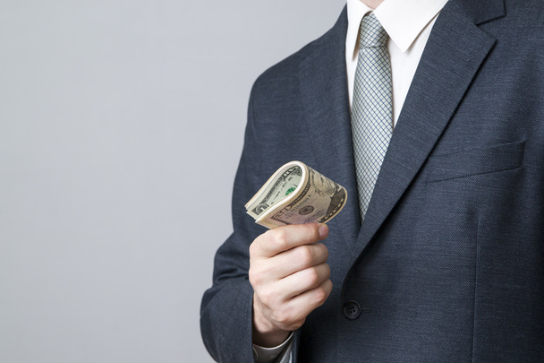 Businessman with money in studio - Zdjęcie, obraz