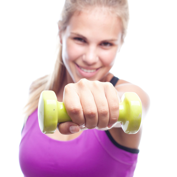 young cool woman with a dumbbell - Foto, afbeelding